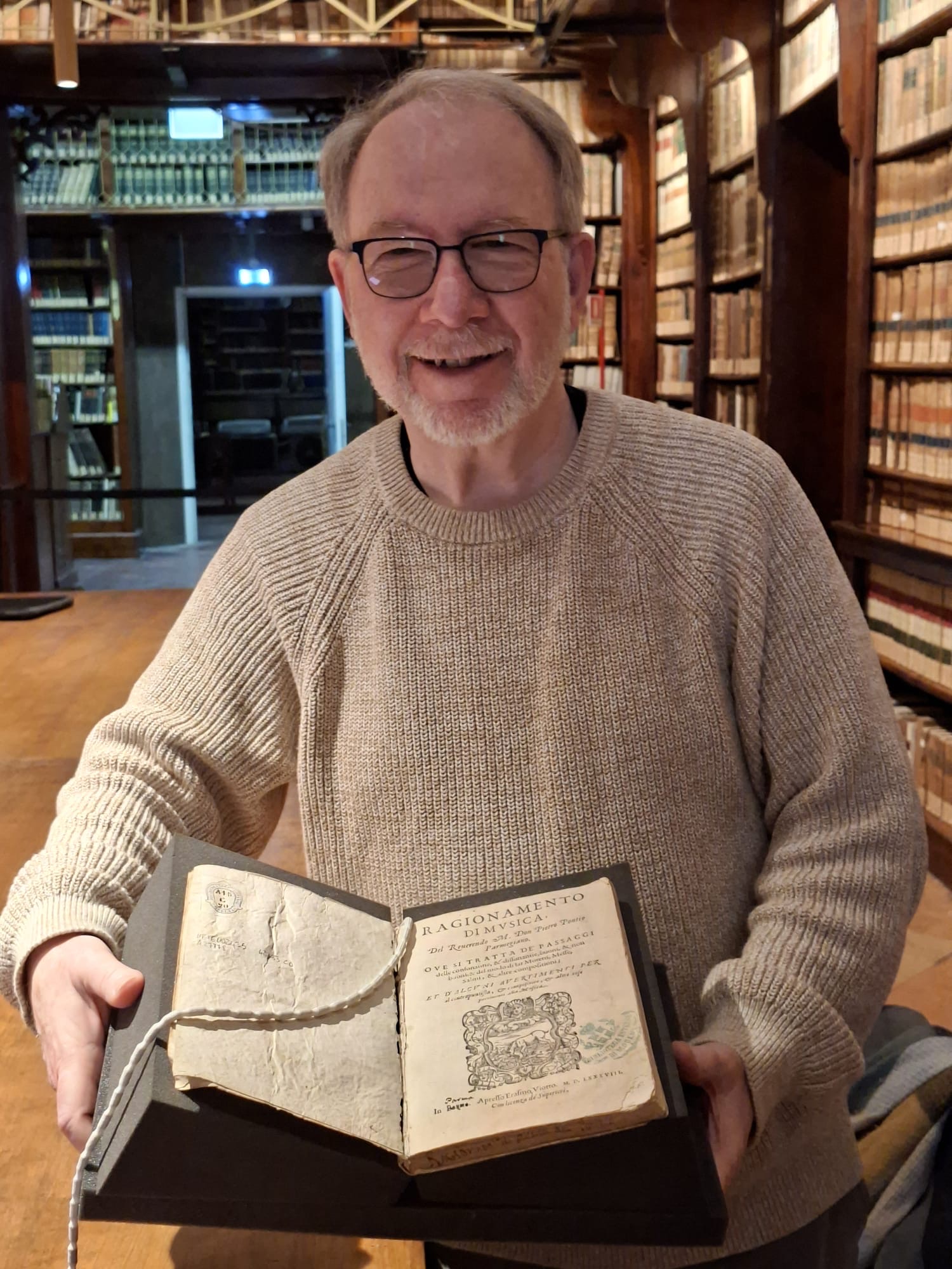 Professor Murray is very happy to hold Pontio's prints in his hands.